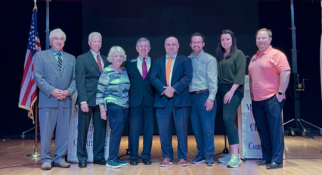 Community leaders and professionals at a Chamber of Commerce event