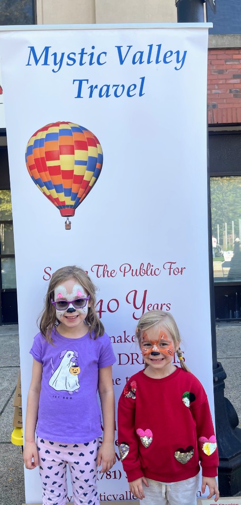 Face painting and family fun at a sponsor booth