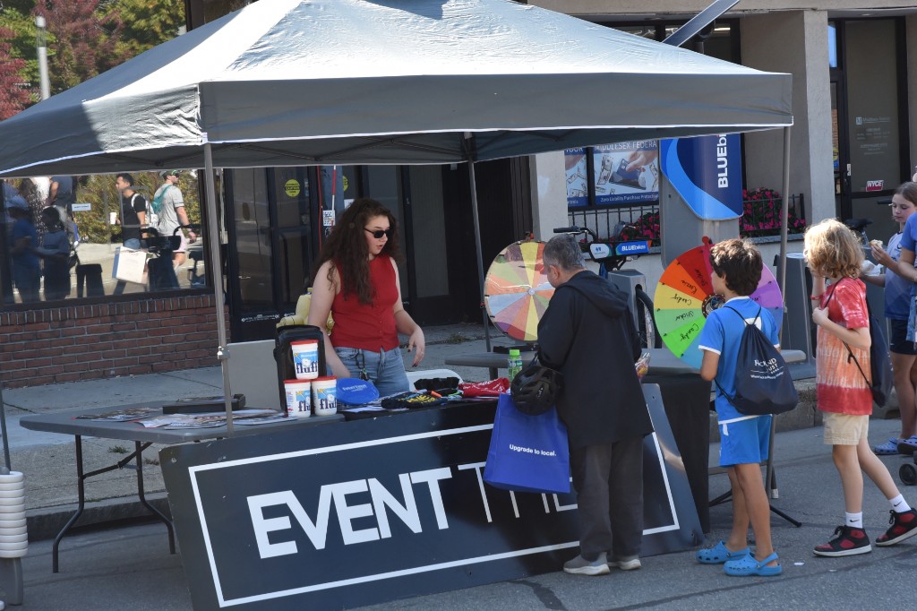 Prize wheel and activities at a community booth